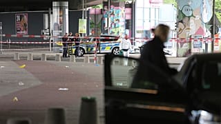 Police and forensic investigators are on the scene following an attack in the western city of Bielefeld, Germany, Sunday May 18, 2025. (Christian Müller/dpa via AP)