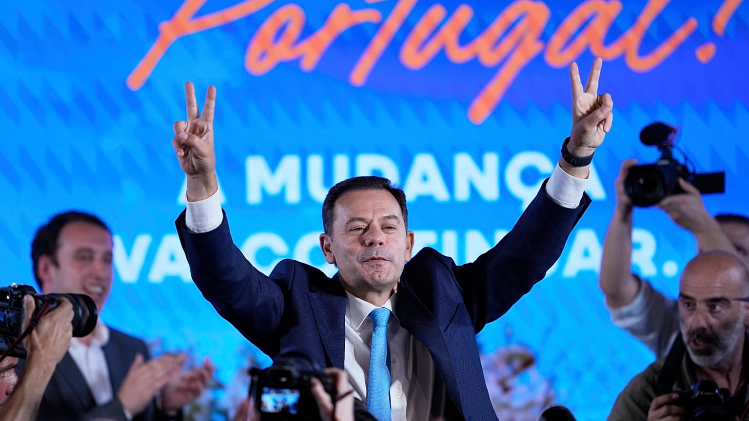 Leader of the center-right Social Democratic Party Luis Montenegro gestures while addressing his supporters following Portugal's general election, in Lisbon.