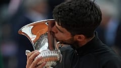 Carlos Alcaraz of Spain kisses the trophy after winning the Italian Open tennis tournament at the Foro Italico in Rome, 18 May 2025