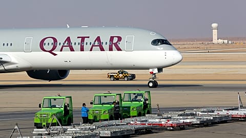 FILE - The first Qatar Airways plane in three years lands at King Khalid Airport in Riyadh, Saudi Arabia, Monday, Jan. 11, 2021