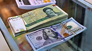 الريال الإيراني والدولار الأميركي
