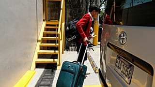 A Honduran migrant who returned voluntarily from the United States walks after arriving at Ramon Villeda Morales Airport in San Pedro Sula, Honduras, Monday, May 19, 2025.