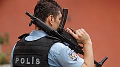 FILE: An armed Turkish police officer secures a road in Istanbul, 10 August 2015