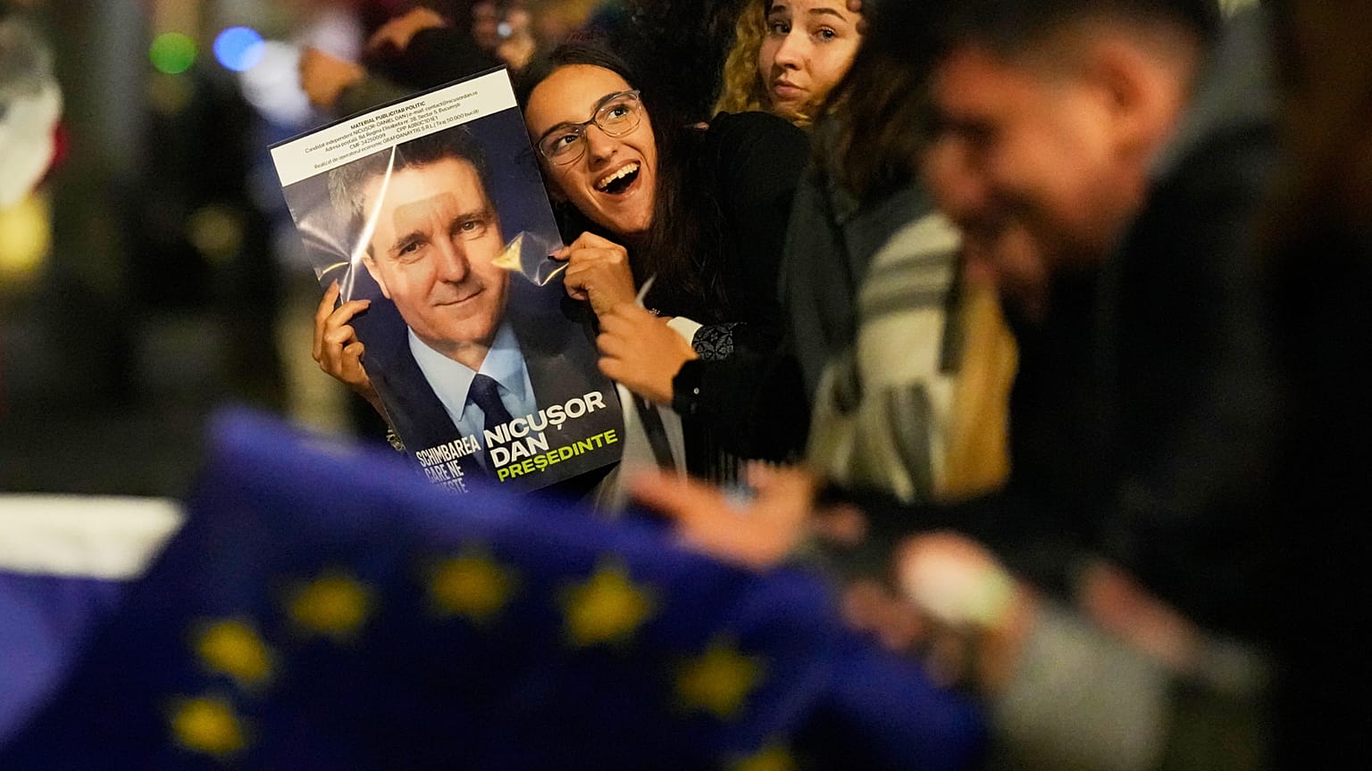 Supporters of Presidential candidate Nicușor Dan celebrate on the street after polls closed in the country's presidential runoff in Bucharest, 18 May, 2025