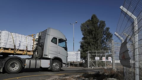 A truck carrying humanitarian aid for the Gaza Strip enters to Kerem Shalom Crossing in southern Israel, Tuesday May 20, 2025. 