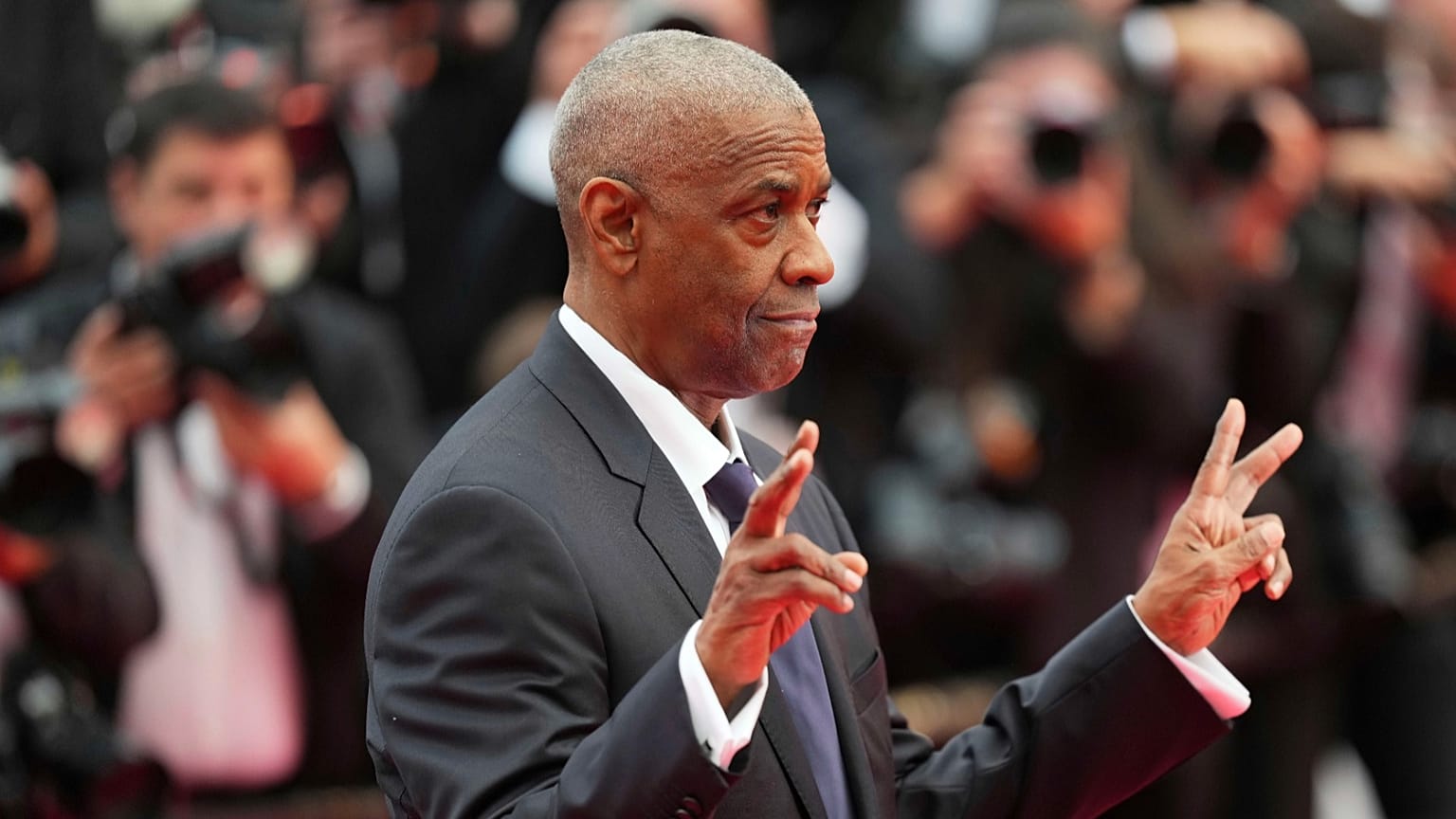 Denzel Washington receives surprise honorary Palme d'Or at Cannes premiere for 'Highest 2 Lowest' 
