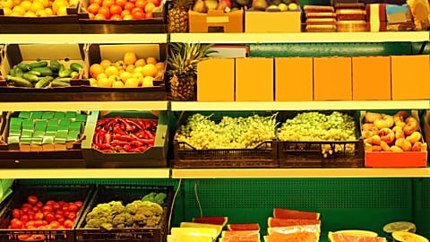 Rows of fruits and vegetables at a supermarket