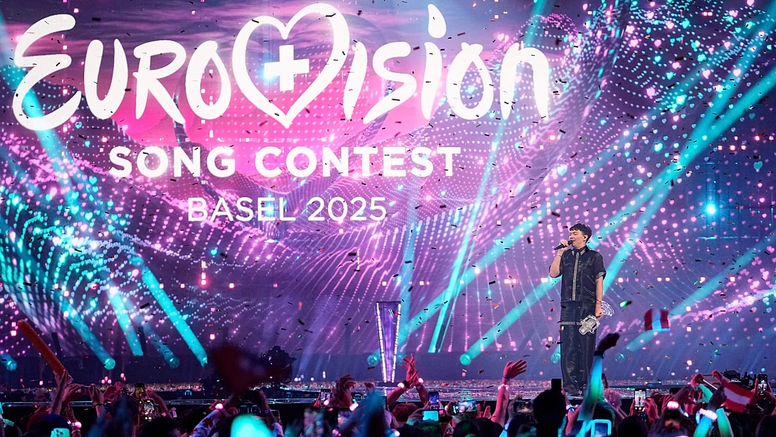Winner of the Eurovision Song Contest JJ from Austria holds up the trophy onstage in Basel, 18 May, 2025 