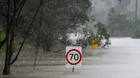 FILE PHOTO - A flooded road in Londonderry on the outskirts of Sydney, Australia, Monday, July 4, 2022. 