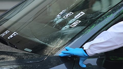 Crime scene investigators work at the site where the personal secretary and an adviser to Mexico City's mayor were killed in Mexico City on 20 May, 2025.