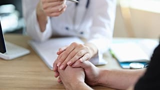 A doctor discusses a patient's diagnosis.