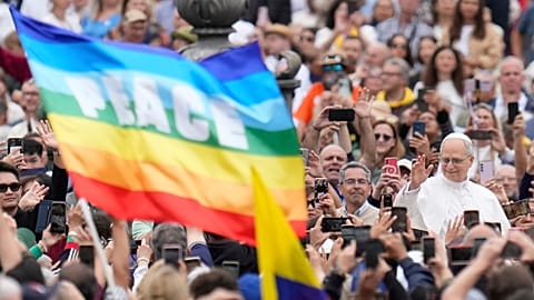 Pope Leo XIV waves to faithful as he arrives for his first weekly general audience in St Peter's Square at The Vatican, 21 May, 2025