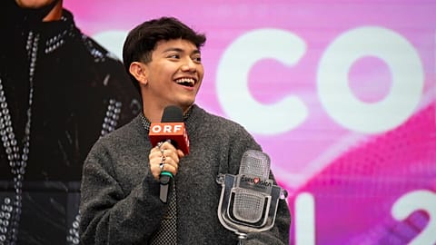 JJ from Austria laughs during a press conference in Vienna, Austria, on Sunday, May 18, 2025.
