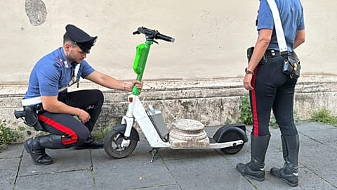 Two Carabinieri officers with the recovered artefact on top of a scooter, in Rome, 21 May 2025