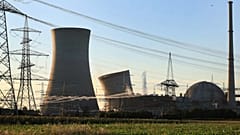 The first cooling tower of the decommissioned nuclear power plant collapses during a controlled demolition in Grafenrheinfeld, 16 August 2024