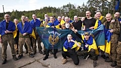 Ukrainian soldiers pose after returning from captivity during an exchange between Russia and Ukraine in the Chernyhiv region, 23 May, 2025