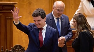 Romanian President Nicușor Dan waves before taking the oath as the country's new president at the parliament in Bucharest, 26 May, 2025