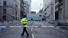 Police work at the scene where a car collided with pedestrians during Monday's Premier League winners parade near the Liver Building in Liverpool, 26 May 2025