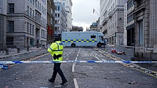 Police work at the scene where a car collided with pedestrians during Monday's Premier League winners parade near the Liver Building in Liverpool, 26 May 2025