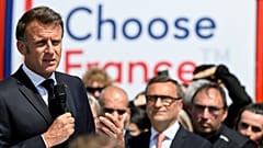French President Emmanuel Macron speaks at the Daimler Buses factory as part of the 8th Choose France summit aimed at attracting foreign investments in France, 19 May 2025..