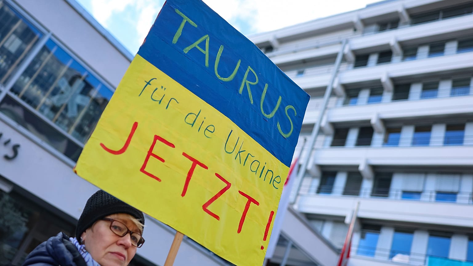 A protester demands the delivery of Taurus cruise missiles to Ukraine on a poster at a solidarity rally for Ukraine in Nuremberg, 24 February, 2024