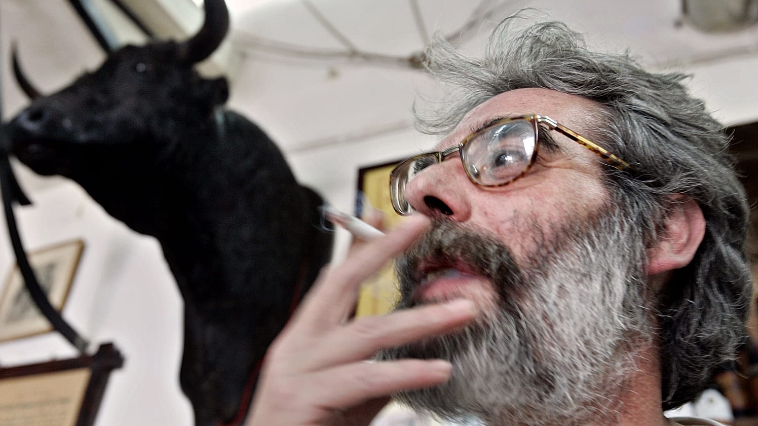 FILE: A man smokes a cigarette in a bar on World No Tobacco Day in Cordoba, 31 May 2005