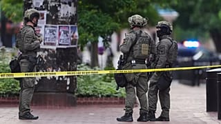 Law enforcement officials investigate after an attack on the Pearl Street Mall, Sunday, June 1, 2025, in Boulder, Colo.