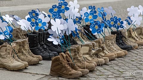 Soldiers' shoes filled with flowers