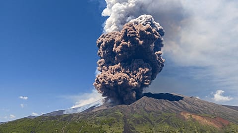 Smoke billows from Mount Etna volcano, Italy.