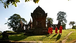 Cambodian Buddhist monks walk through the compound of Preah Vihear Temple near the Thai border, 12 November, 2013