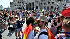 Couples kiss during a flash mob prior to the 24th Budapest Pride in the Hungarian capital, 6 July, 2019