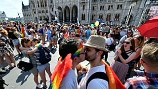 Couples kiss during a flash mob prior to the 24th Budapest Pride in the Hungarian capital, 6 July, 2019