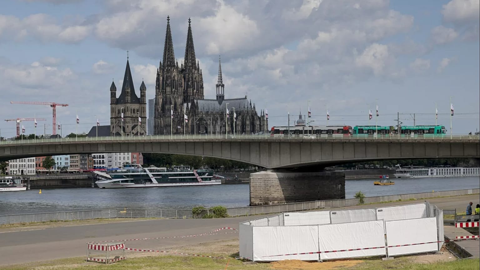 One of the three unexploded bombs from the Second World War is fenced off with screens as specialists prepare to defuse them in Cologne, Tuesday, June 3, 2025.