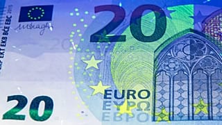 FILE: UV light shows security features of the new twenty euro banknote during a press conference at a branch office of the German Federal Bank in Erfurt, 27 October 2015