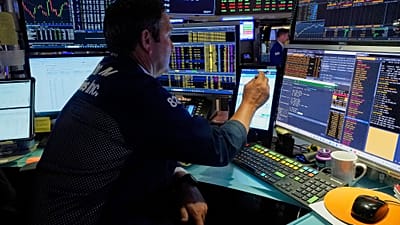 Trader working at stock exchange (file photo)