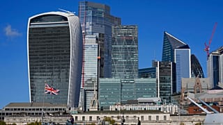 A general view of the skyline of the financial district, is seen by the River Thames, in London.