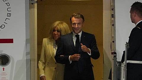 FILE - French President Emmanuel Macron and his wife Brigitte Macron disembark upon arrival in Jakarta, Indonesia, Tuesday, May 27, 2025. (AP Photo/Achmad Ibrahim)