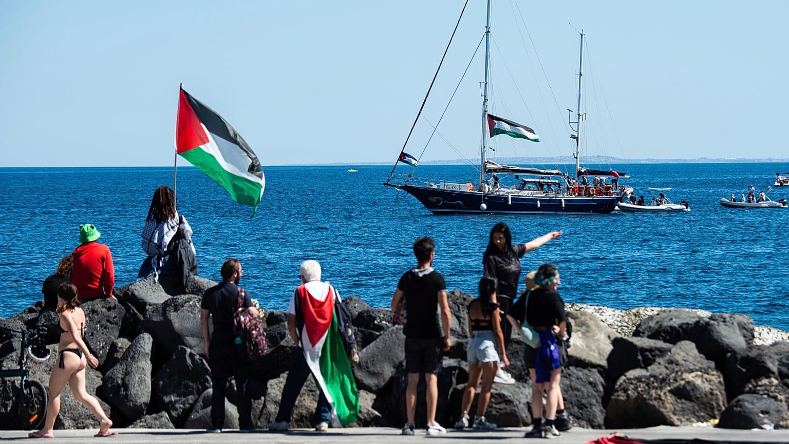 Activists of the Freedom Flotilla Coalition board the Madleen boat ahead of setting sail for Gaza from the Sicilian port of Catania, 1 June, 2025 