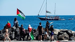 Activists of the Freedom Flotilla Coalition board the Madleen boat ahead of setting sail for Gaza from the Sicilian port of Catania, 1 June, 2025 
