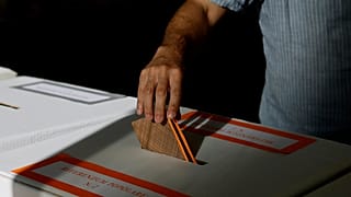 A man casts his ballot on referendums on citizenship and job protections at a polling station in Rome, 8 June, 2025