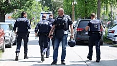 Police officers attend the scene of a shooting at a school in Graz, 10 June 2025