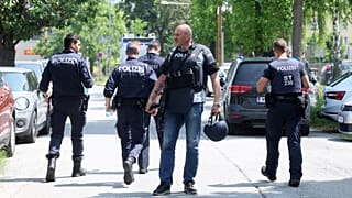 Police officers attend the scene of a shooting at a school in Graz, 10 June 2025