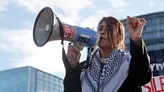 Member of European Parliament Rima Hassan speaks during a pro-Palestinian demonstration outside the European Parliament in Strasbourg, France