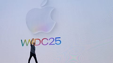 Apple CEO Tim Cook waves to attendees during an event on the Apple campus in Cupertino, Calif., Monday, June 9, 2025.