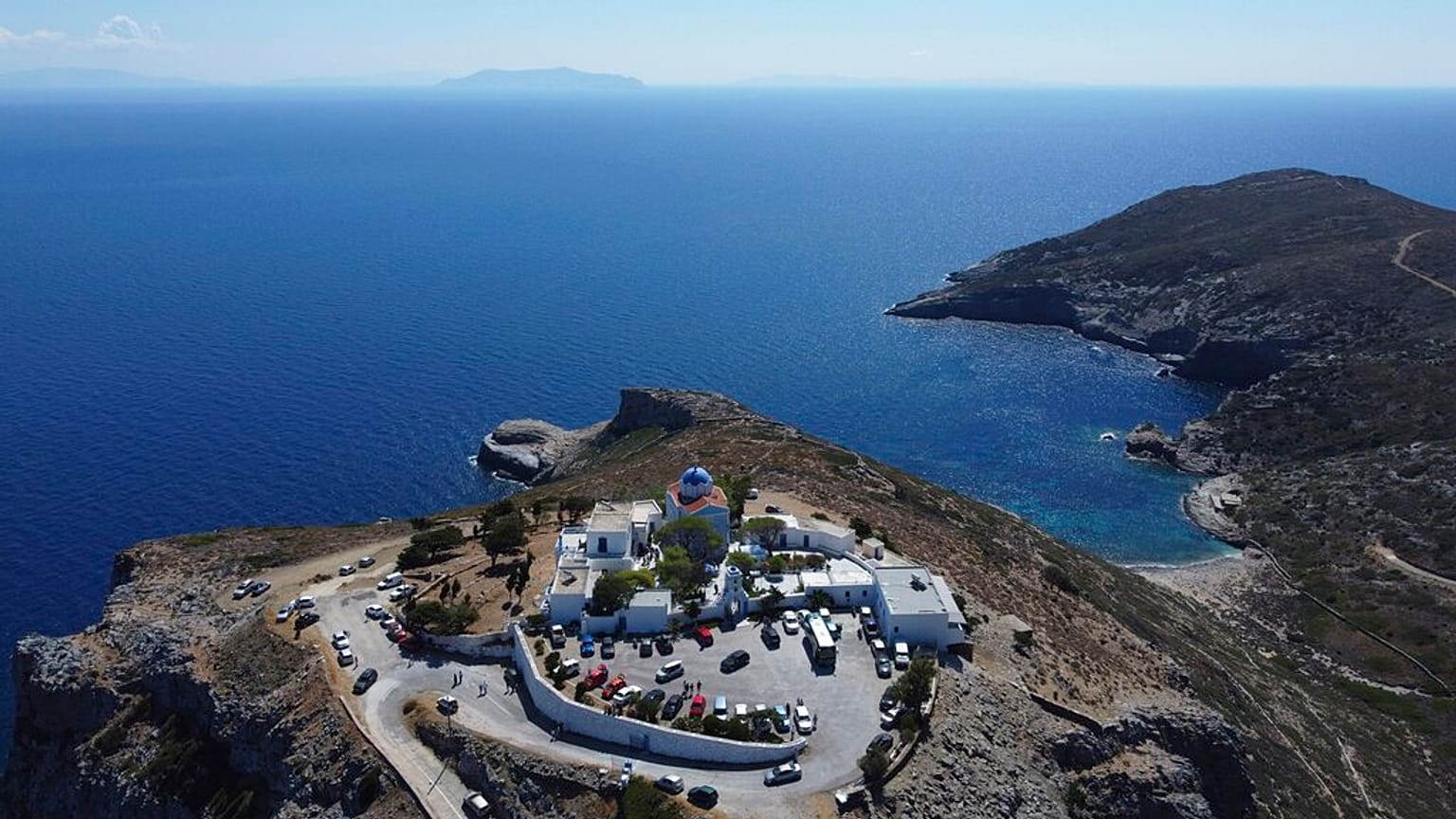 Panagia Kastriani monastery is seen atop of a hill after a church service on the Aegean Sea island of Tzia or Kea, Greece, Monday, Aug. 15, 2022. 