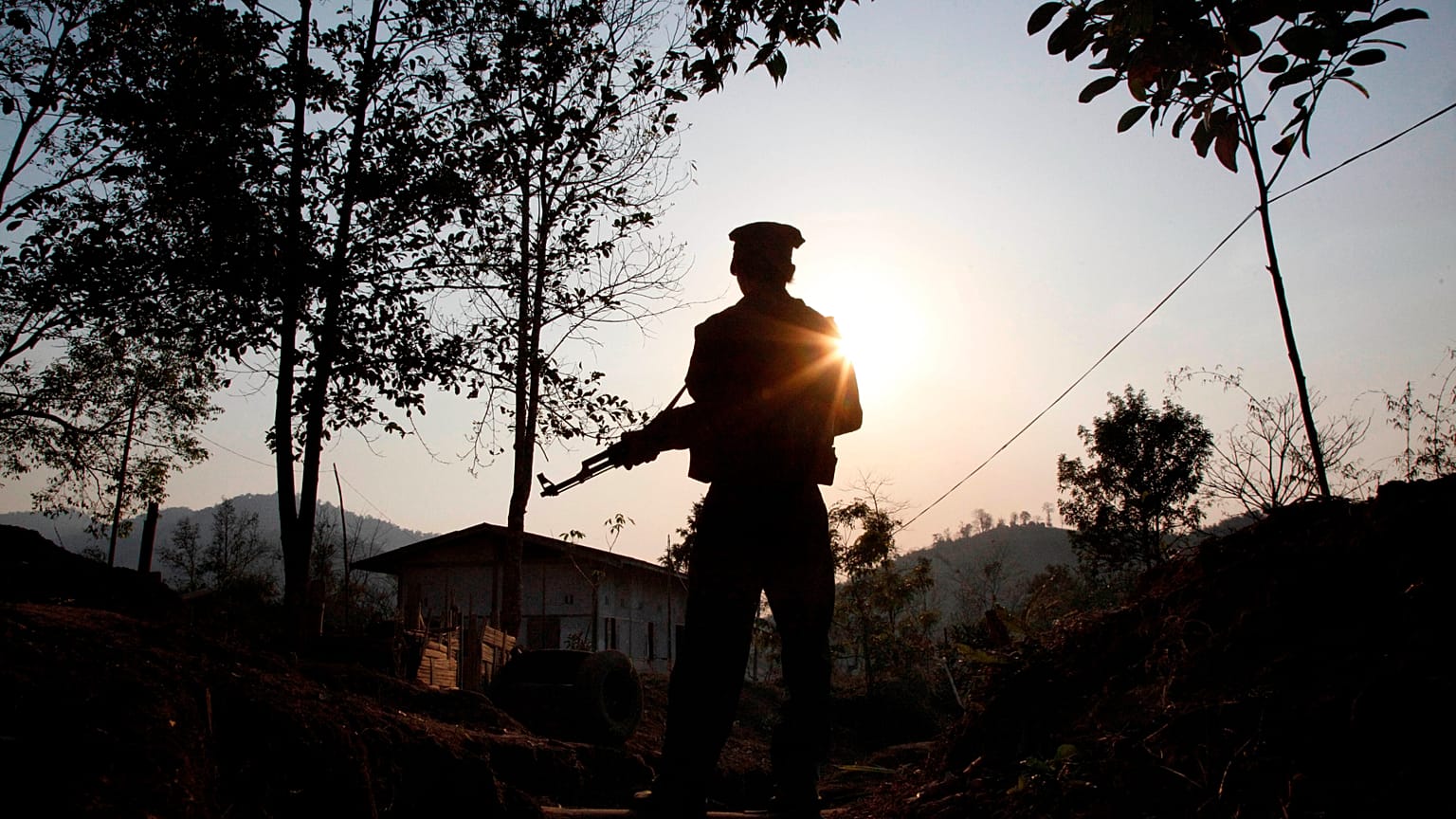 A rebel fighter stands at a frontline outpost facing no man's land in Lawa Yang in northern Kachin state, 20 March, 2018