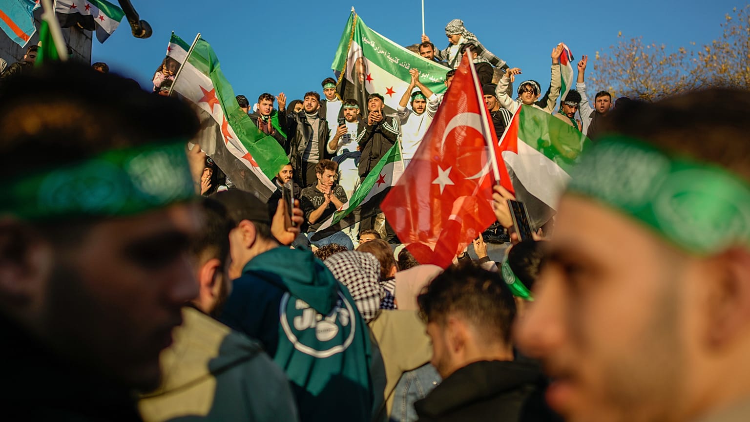 People gather to celebrate the Syrian government's fall in Istanbul, 8 December, 2024