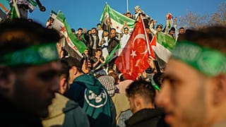People gather to celebrate the Syrian government's fall in Istanbul, 8 December, 2024