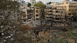 Rescue teams work at the site where a missile launched from Iran struck Tel Aviv, 16 June, 2025