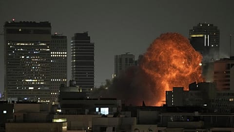 An explosion is seen during a missile attack in Tel Aviv, Israel, Sunday, June 15, 2025.